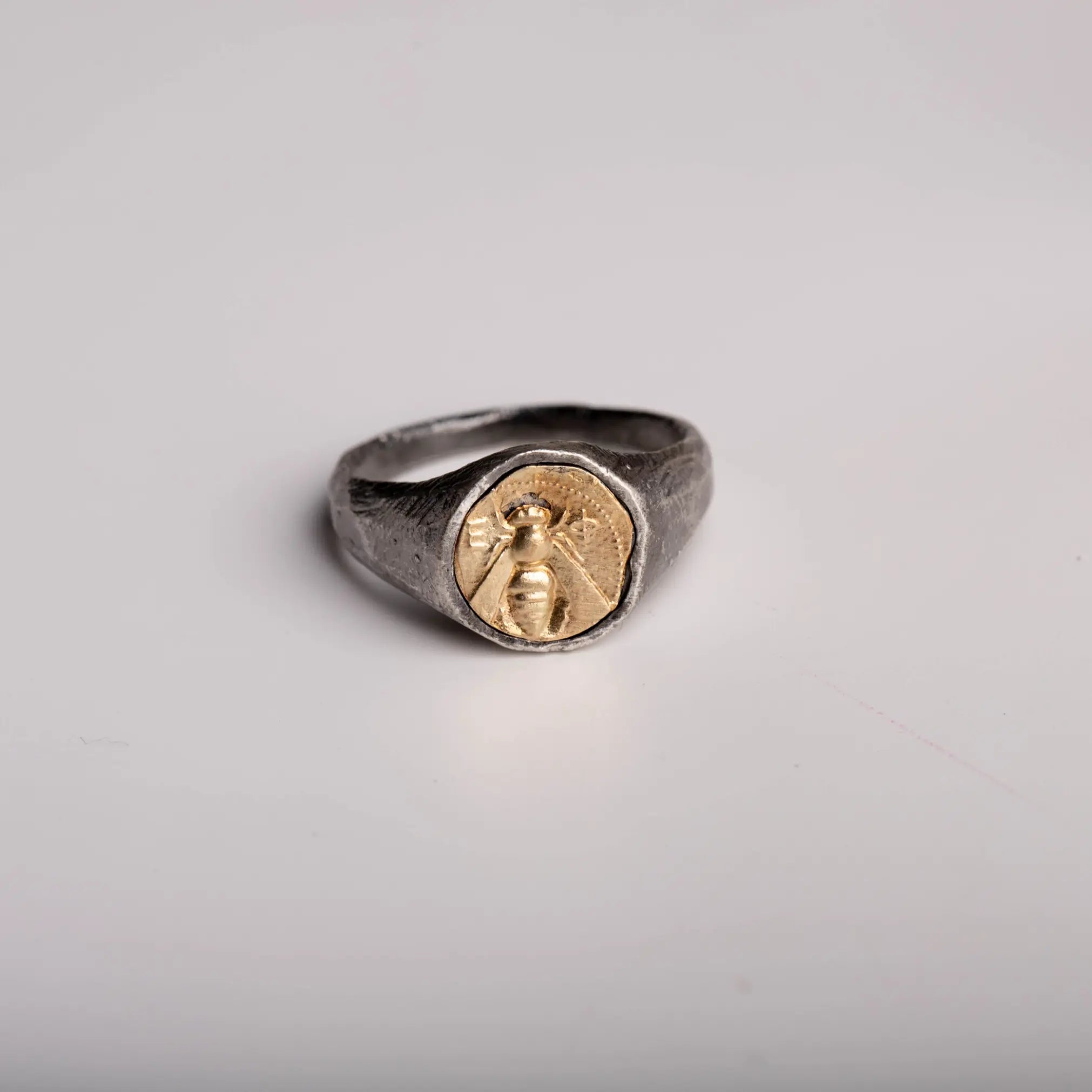 Greek Bee Ring with 14K Gold Bee Motif, inspired by ancient Greek mythology, crafted in sterling silver with gold accent.